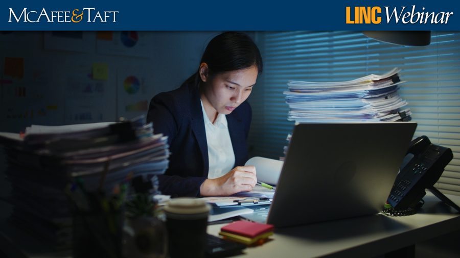 Asian businesswoman working late in office at night