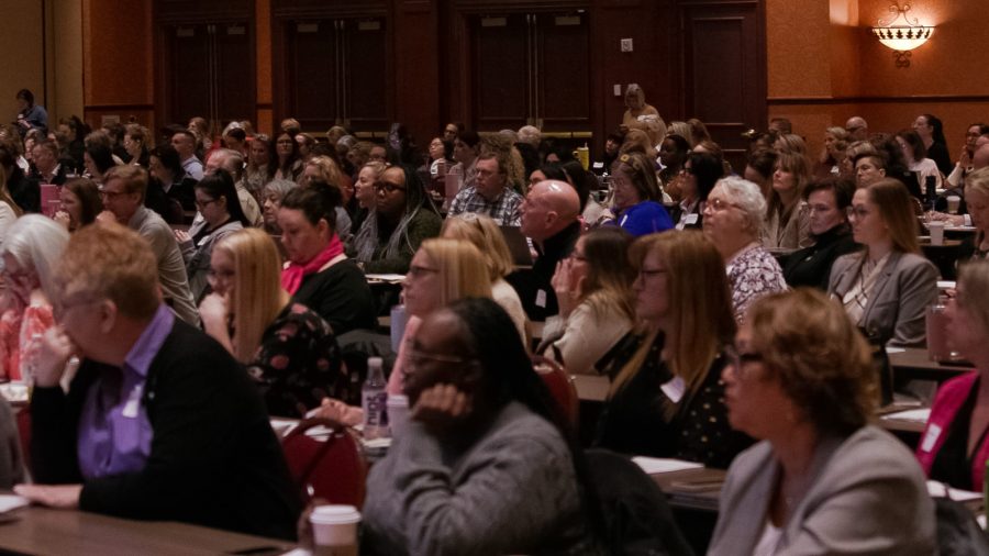 Attendees watch presentations during McAfee & Taft's EmployerLINC 25: HR Land seminar at Renaissance Tulsa Hotel & Convention Center on April 4, 2025.