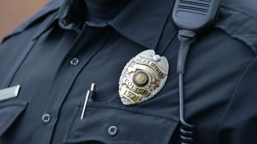 Close up of a badge on a police officer