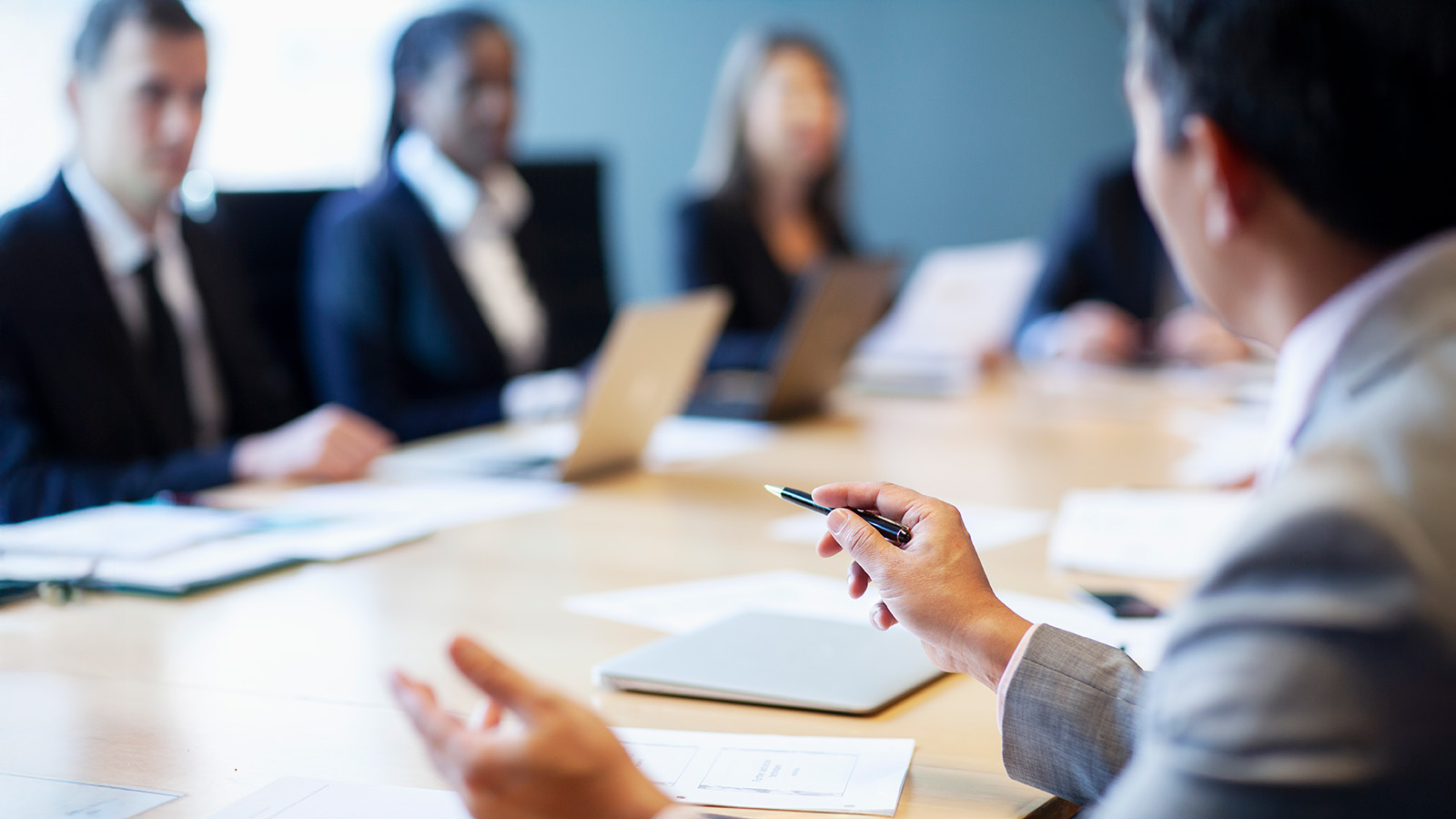 Corporate governance meeting of leadership in the executive boardroom.