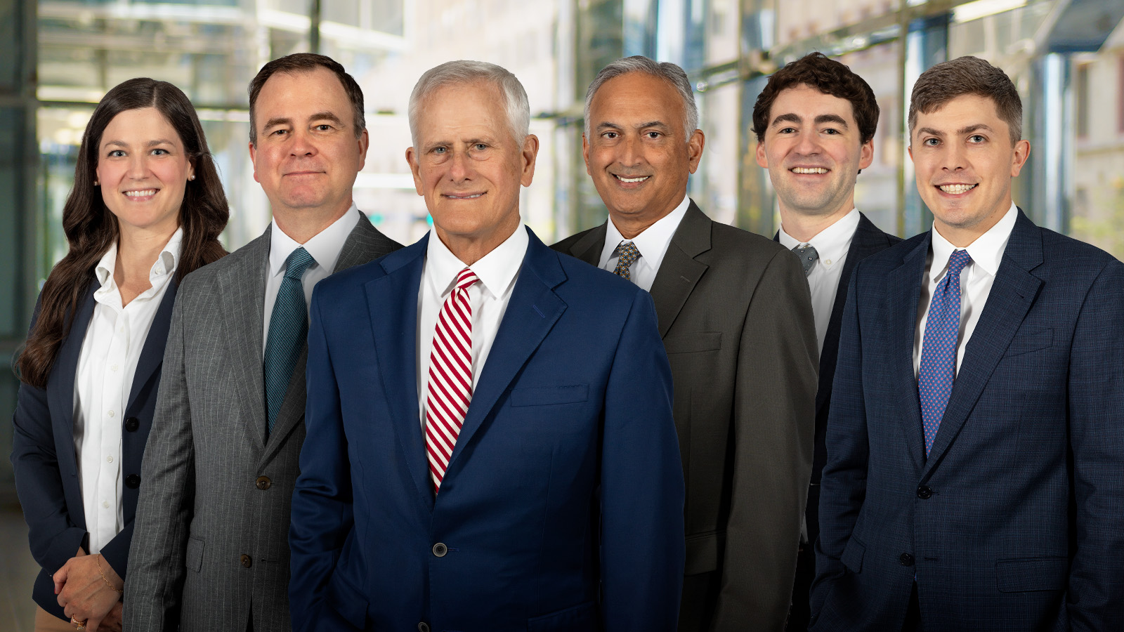 Photo of new team joining McAfee & Taft, with attorneys Beth Attaway, Dillon Curron, Jared Giddens, Kiran Phansalkar, Matt Peace, and Preston Sullivan.